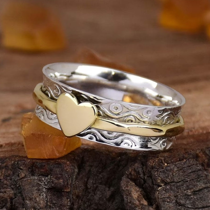 Zilveren spinner ring met gouden hart