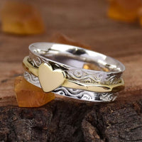 Zilveren spinner ring met gouden hart