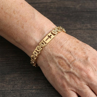 Gouden armbandenset met brede cuff en discs