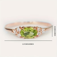 Roségouden ring met ovale peridot en zirkonia