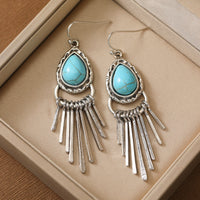 Zilveren bohemian oorbellen met turquoise en franjes