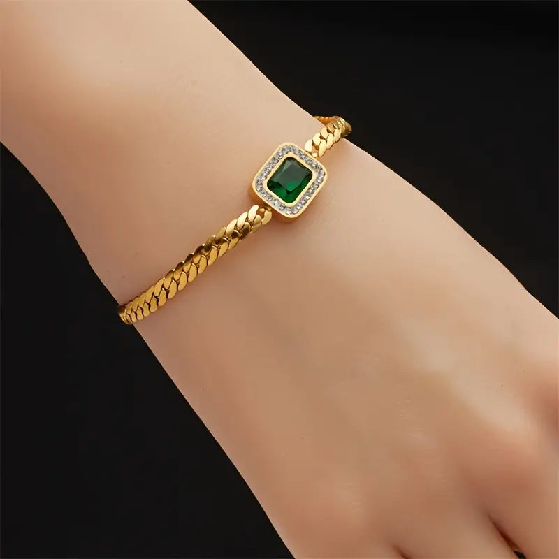 Gouden armband met groene vierkante edelsteen