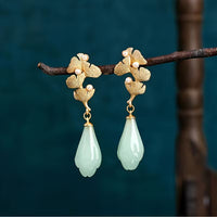 Gouden oorbellen met groene en blauwe edelsteen