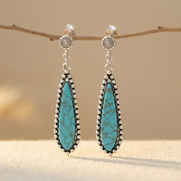 Zilveren western oorbellen met turquoise druppel