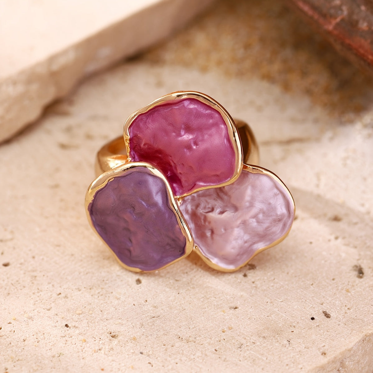 Roségouden ring met roze en paarse edelstenen