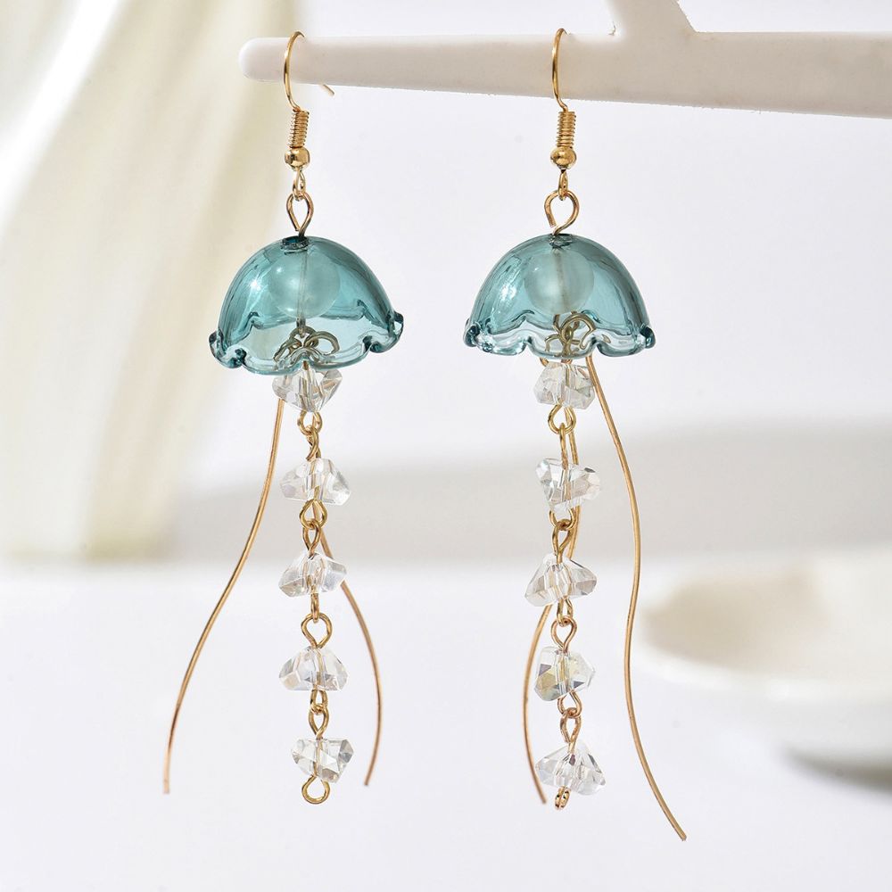 Gouden tassel oorbellen met groene glazen steen
