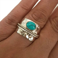 Zilveren brede ring met turquoise en goudaccenten