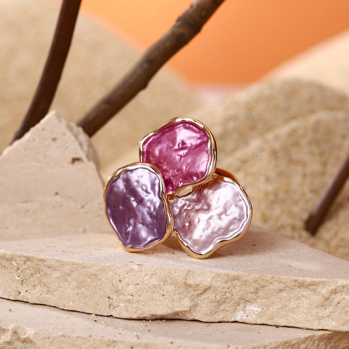 Roségouden ring met roze en paarse edelstenen
