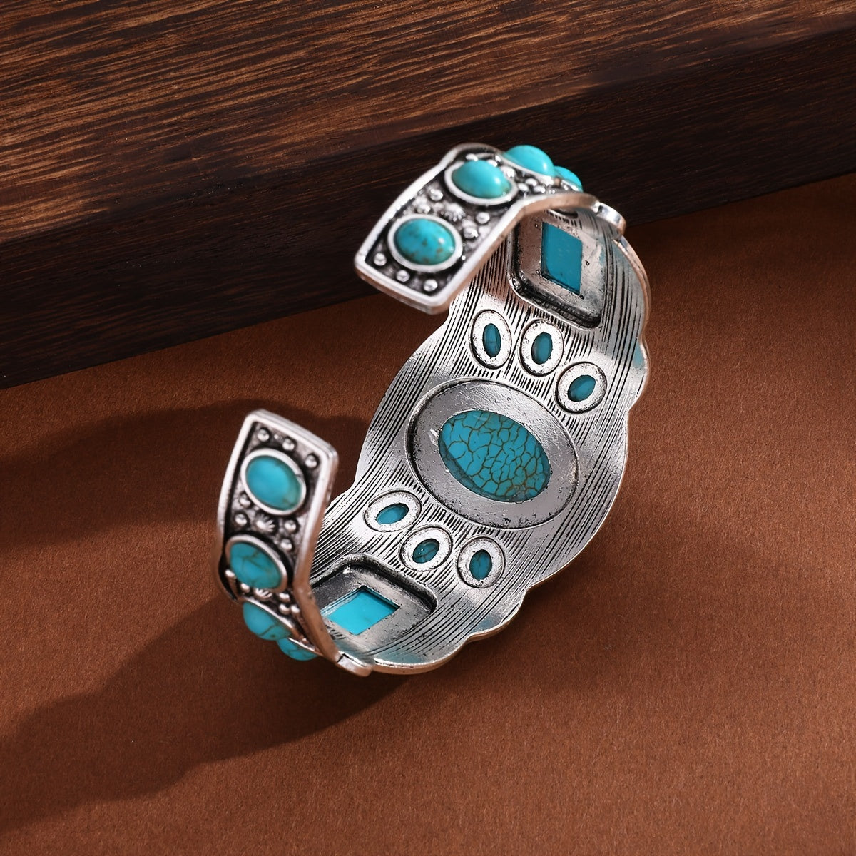Gouden oorbellen met turquoise druppelsteen