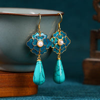 Vintage oorbellen met turquoise bloem en druppelhanger