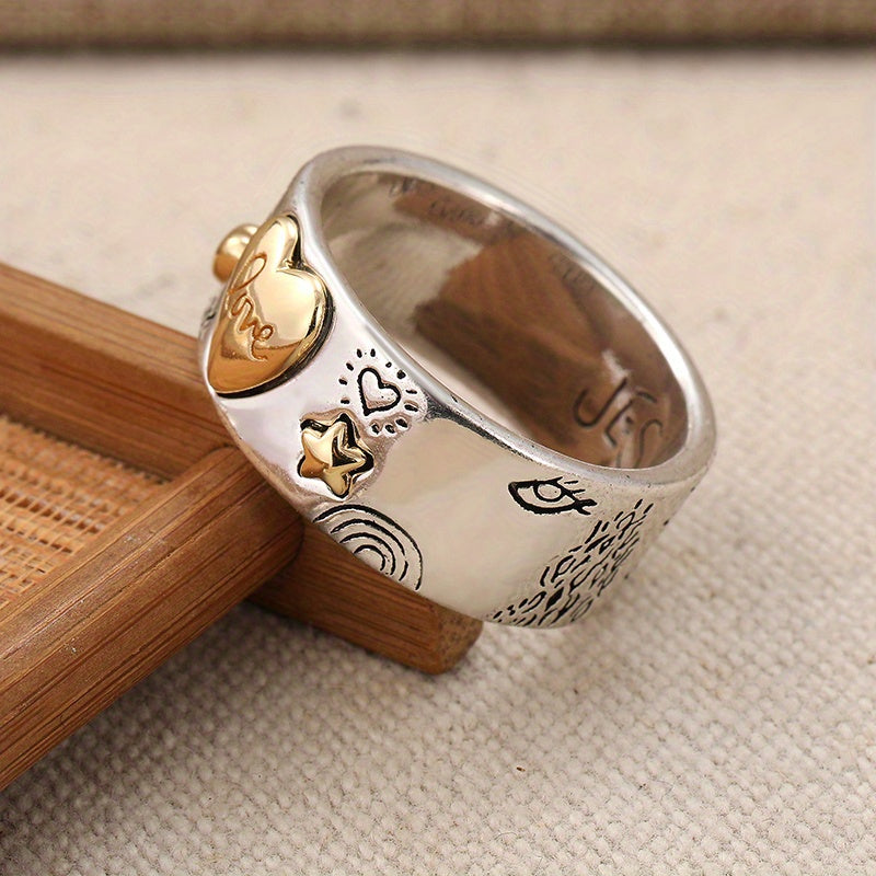 Zilveren ring met gouden hartjes en liefdesboodschap