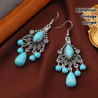 Zilveren bohemian oorbellen met turquoise kralen en bedels