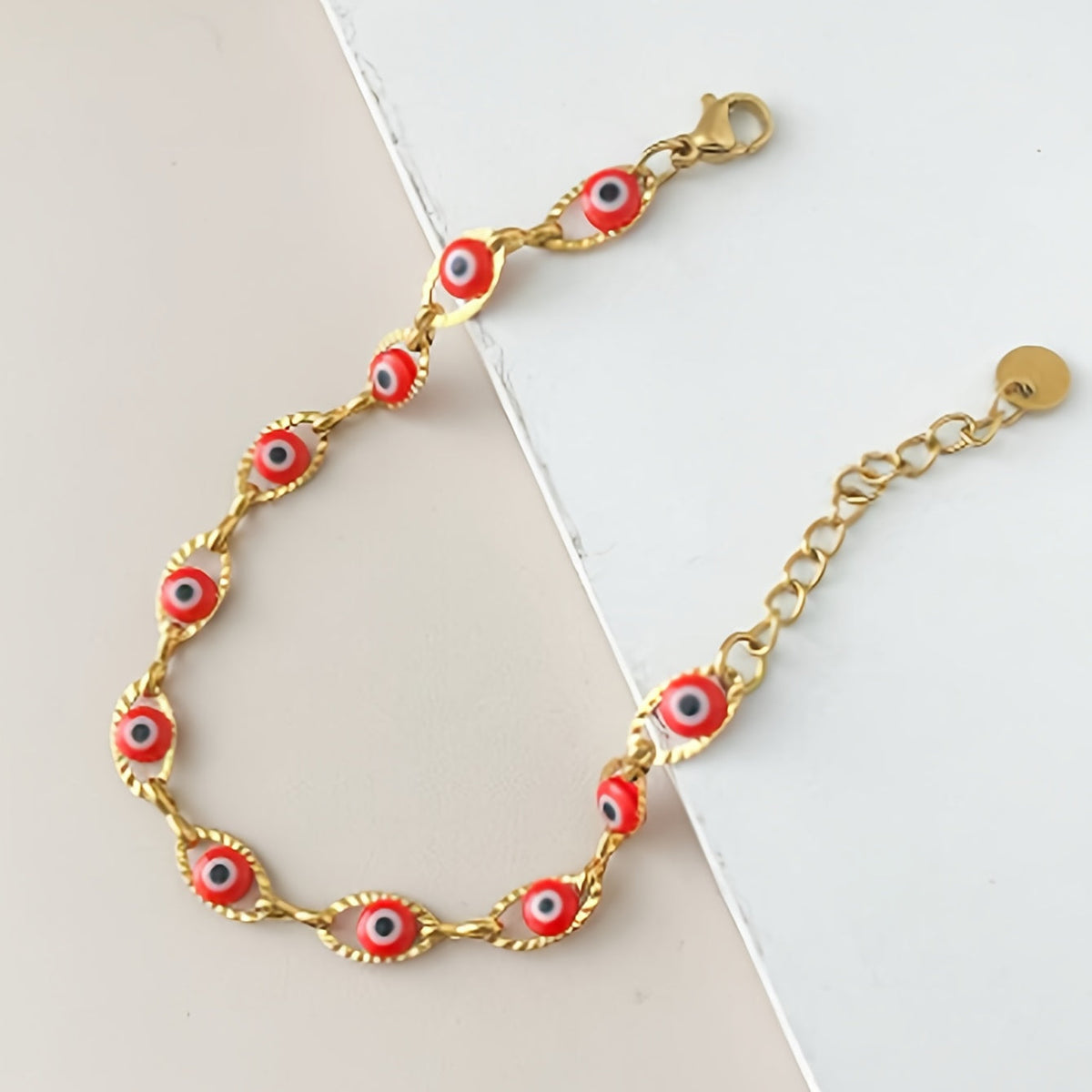 Gouden armband met blauwe boze oog kraaltjes