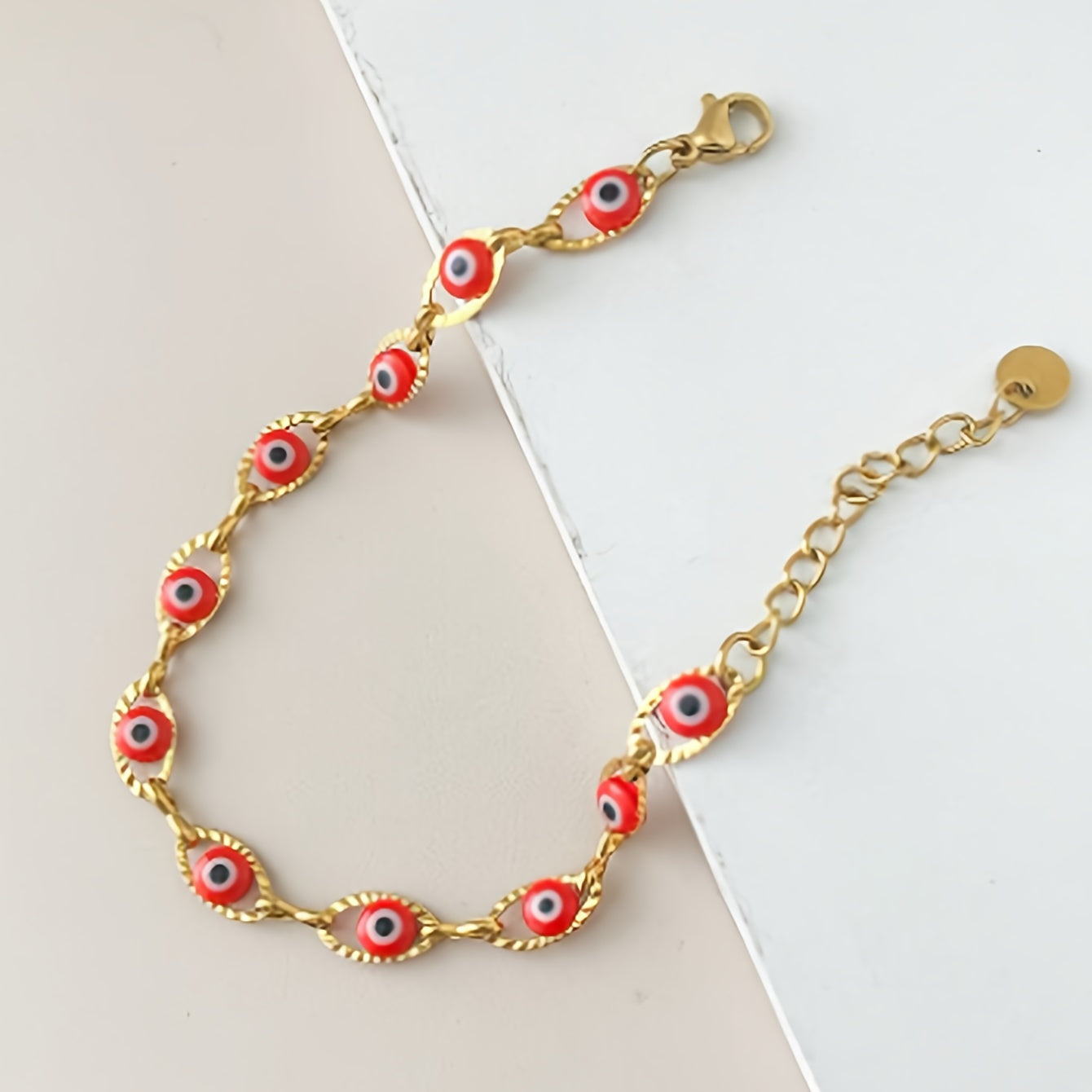 Gouden armband met blauwe boze oog kraaltjes