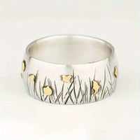Zilveren vintage ring met gouden vogels en bladeren