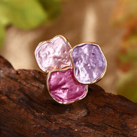 Roségouden ring met roze en paarse edelstenen