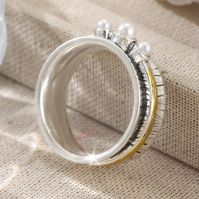 Zilveren ring met parels en goudkleurige spinner band