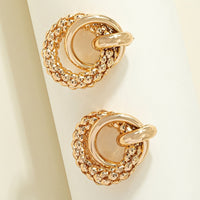 Gouden statement oorbellen met getextureerd cirkelmotief