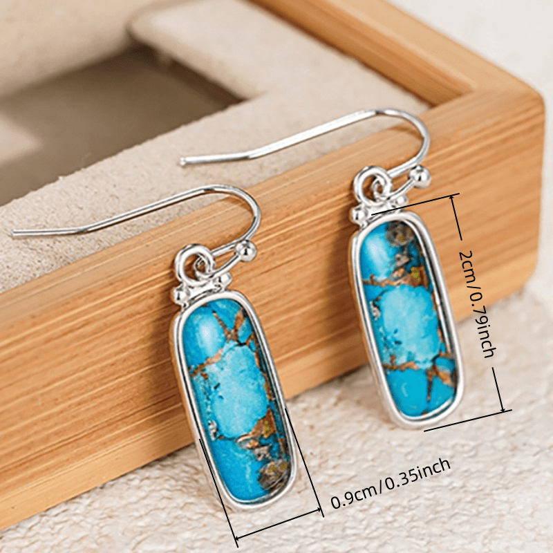 Zilveren oorbellen met rechthoekige turquoise steen