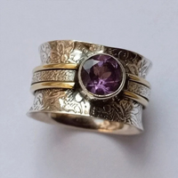 Zilveren spinner ring met paarse amethist