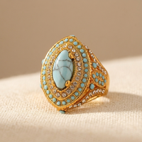Gouden vintage ring met turquoise ovaal en strass