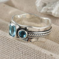 Zilveren ring met twee aquablauwe edelstenen