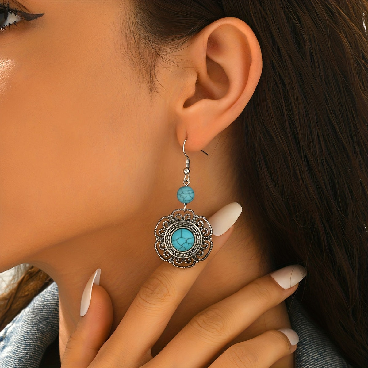 Zilveren boho hartoorbellen met vlinder en turquoise