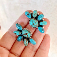 Zilveren oorbellen met ruitvormige turquoise hanger