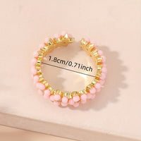Gouden ring met turquoise kralen bloemmotief