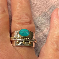 Zilveren brede ring met turquoise en goudaccenten