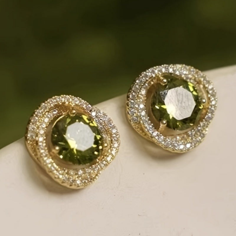 Zilveren vintage oorbellen met groene edelsteen en gevlochten band
