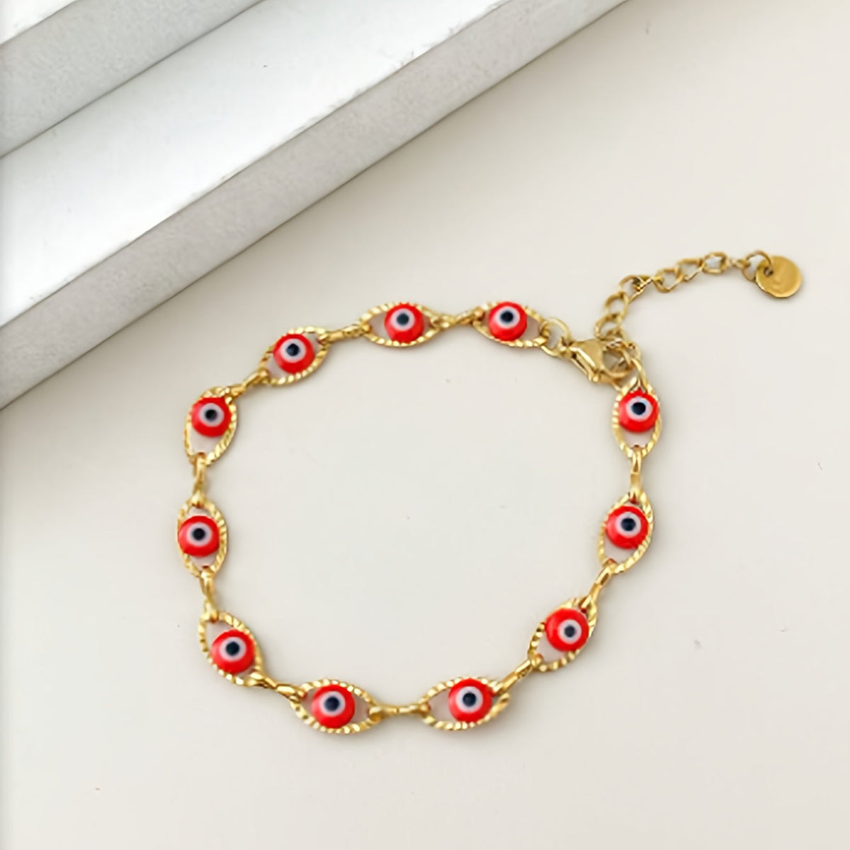 Gouden armband met blauwe boze oog kraaltjes
