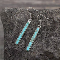 Zilveren oorbellen met langwerpige turquoise staaf