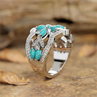 Zilveren ring met turquoise blaadjes en zirkonia