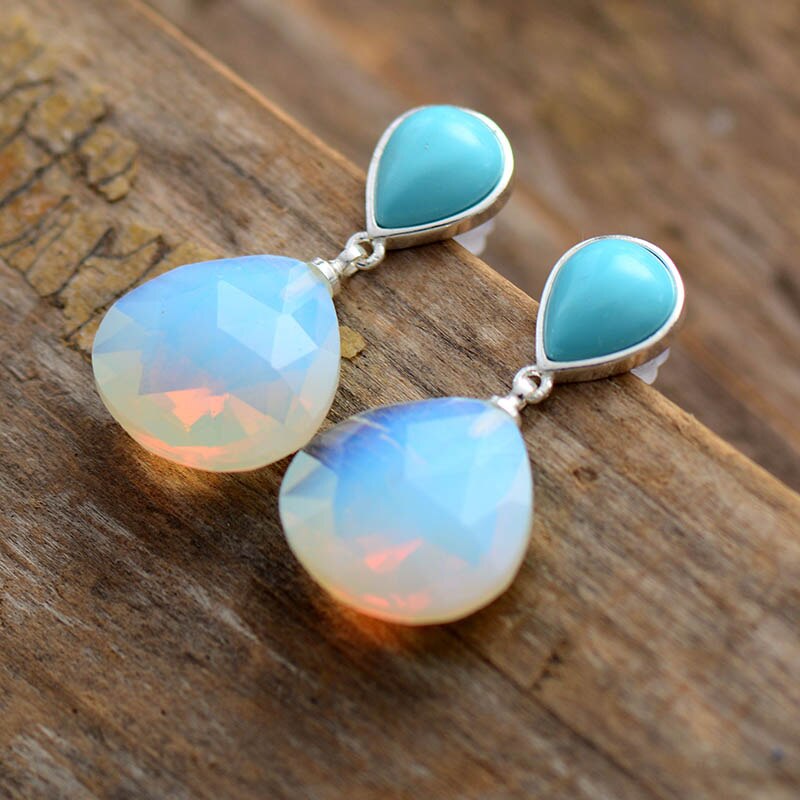 Zilveren oorbellen met turquoise en witte opaal