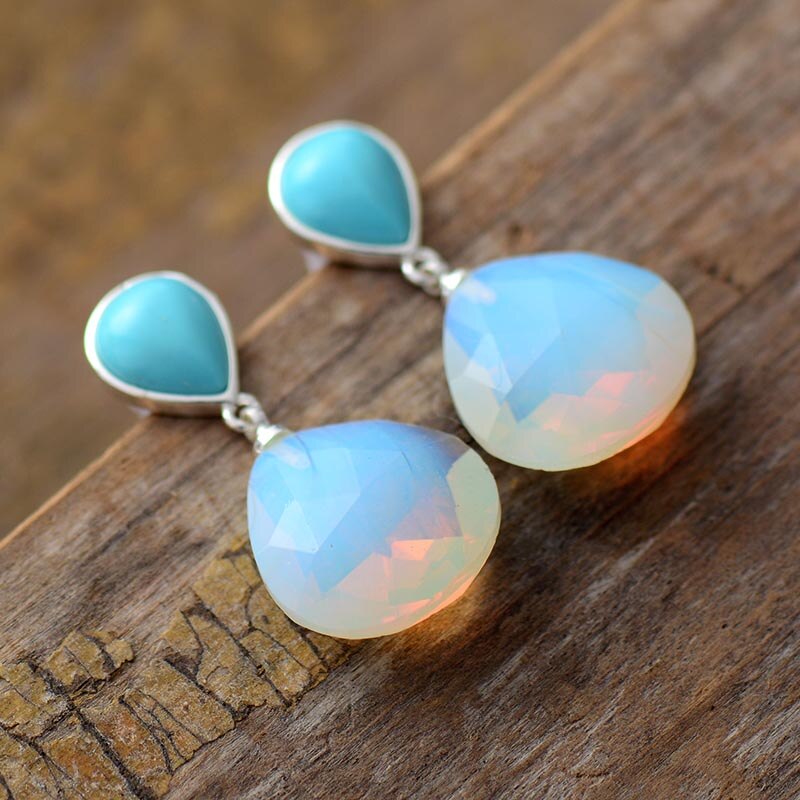 Zilveren oorbellen met turquoise en witte opaal