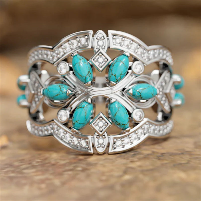Zilveren ring met turquoise blaadjes en zirkonia
