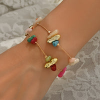 Gouden armband met kleurrijke natuursteen chips