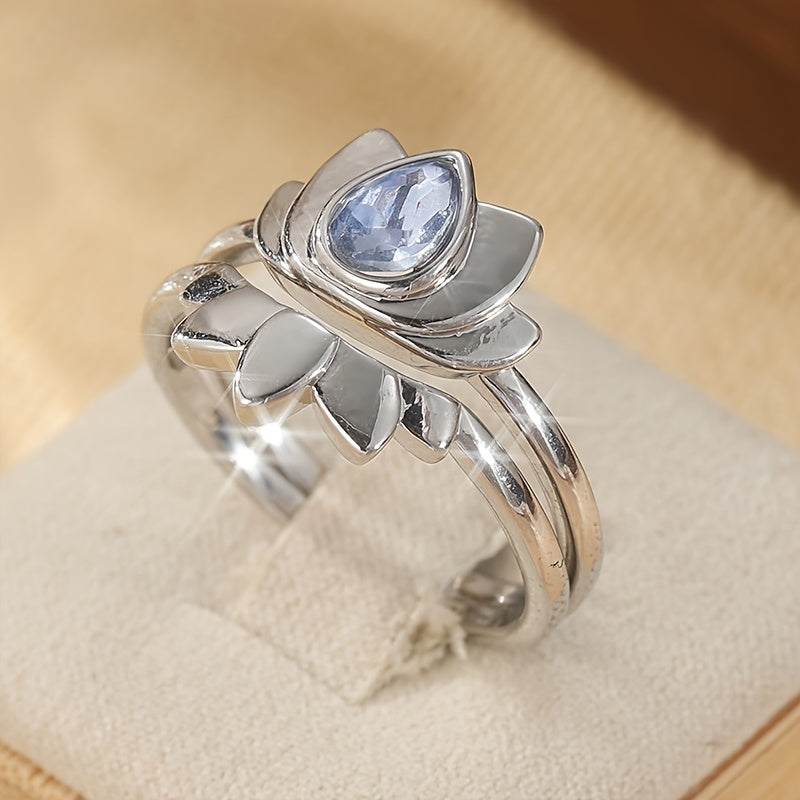 Zilveren lotusring met druppelvormige blauwe steen
