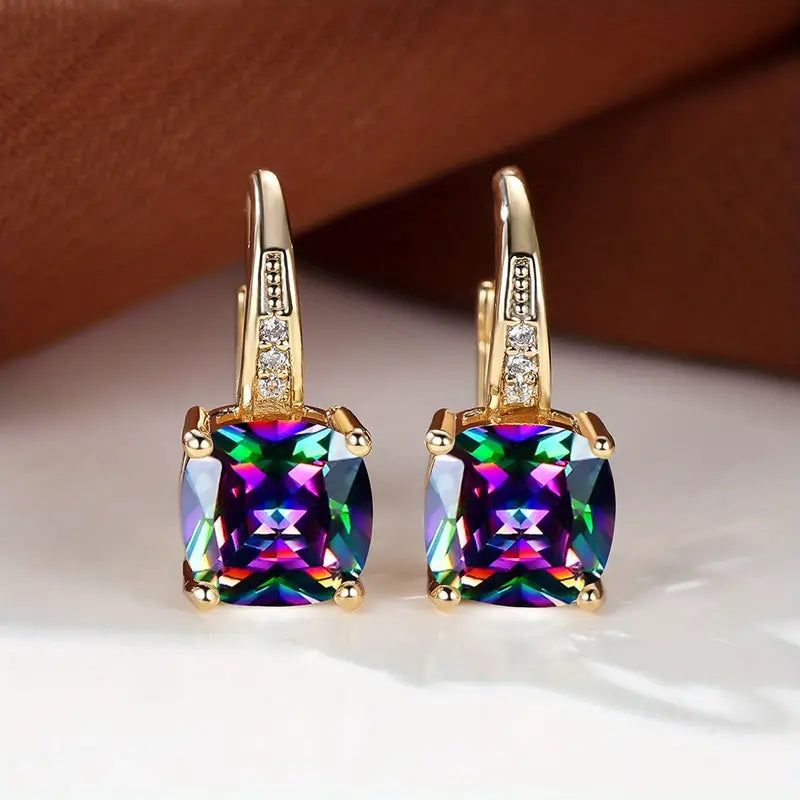 Gouden oorbellen met blauwe kussensteen