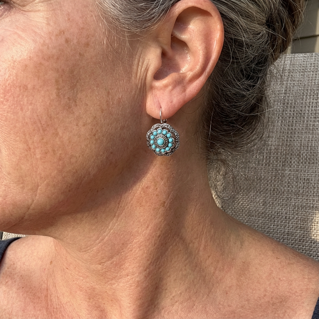 Zilveren oorbellen met turquoise bloem rozet