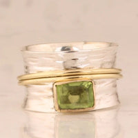 Zilveren spinner-ring met groene peridot