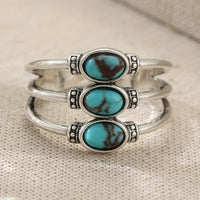 Zilveren bohemian ring met drie turquoise stenen