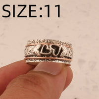 Zilveren spinner ring met hartjes en bloemen