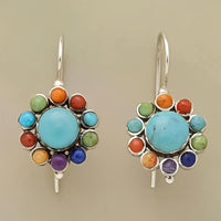 Zilveren oorbellen met turquoise bloemmotief