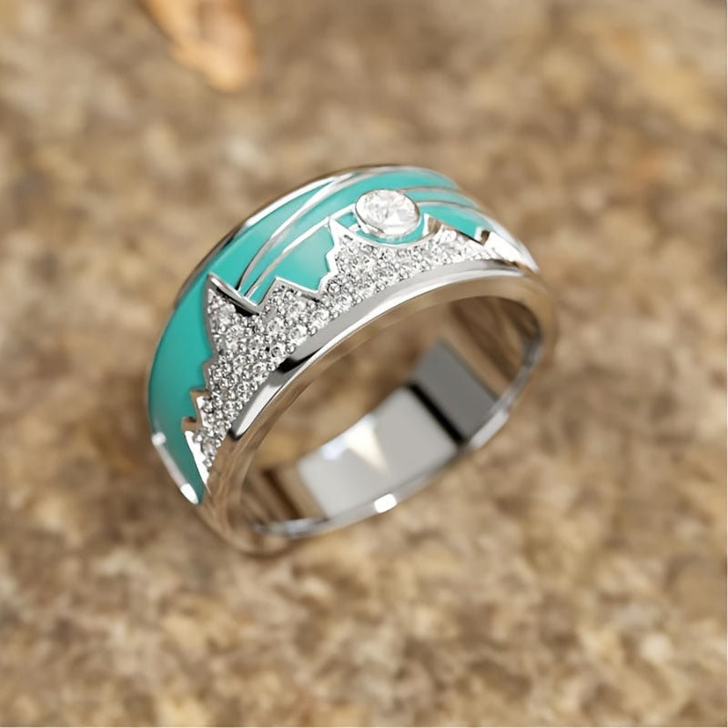 Zilveren ring met turquoise emaille berg-zonmotief en zirkonia