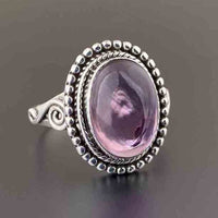Zilveren vintage ring met ovale roze edelsteen