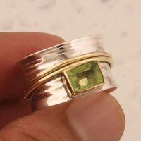 Zilveren spinner-ring met groene peridot