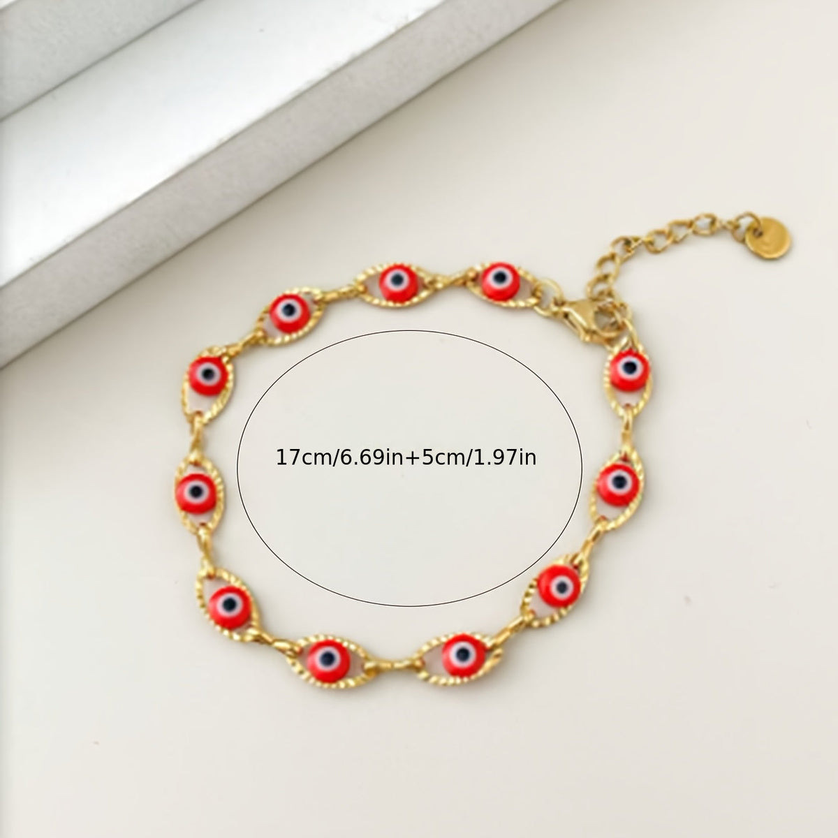 Gouden armband met blauwe boze oog kraaltjes