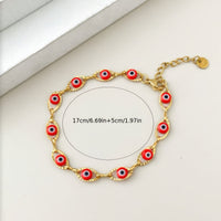 Gouden armband met blauwe boze oog kraaltjes
